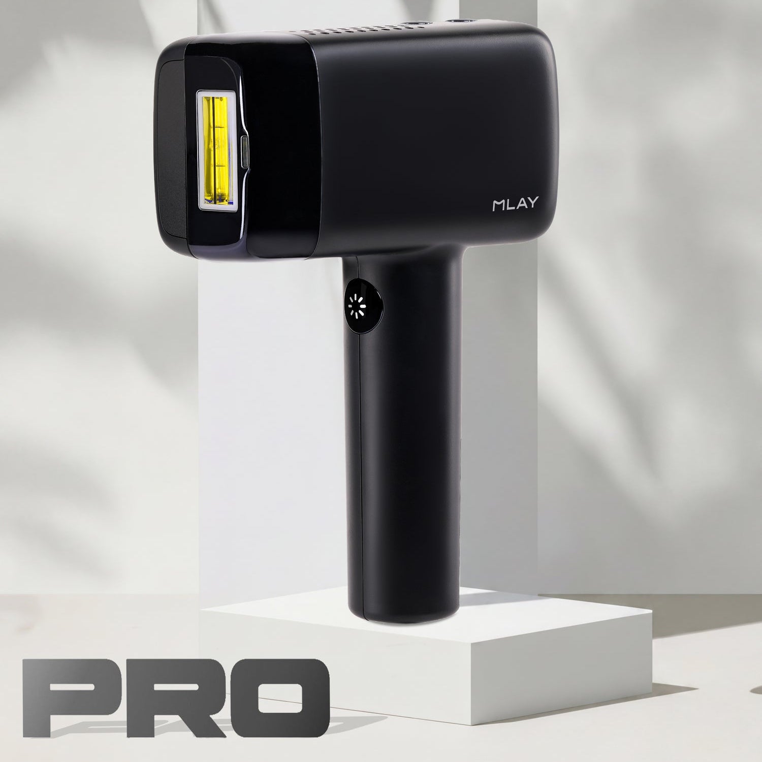 Black handheld device with a yellow light on a white background, branded 'MLAY'.